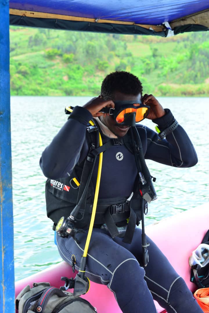 Safety crew helping a diver fit their gear