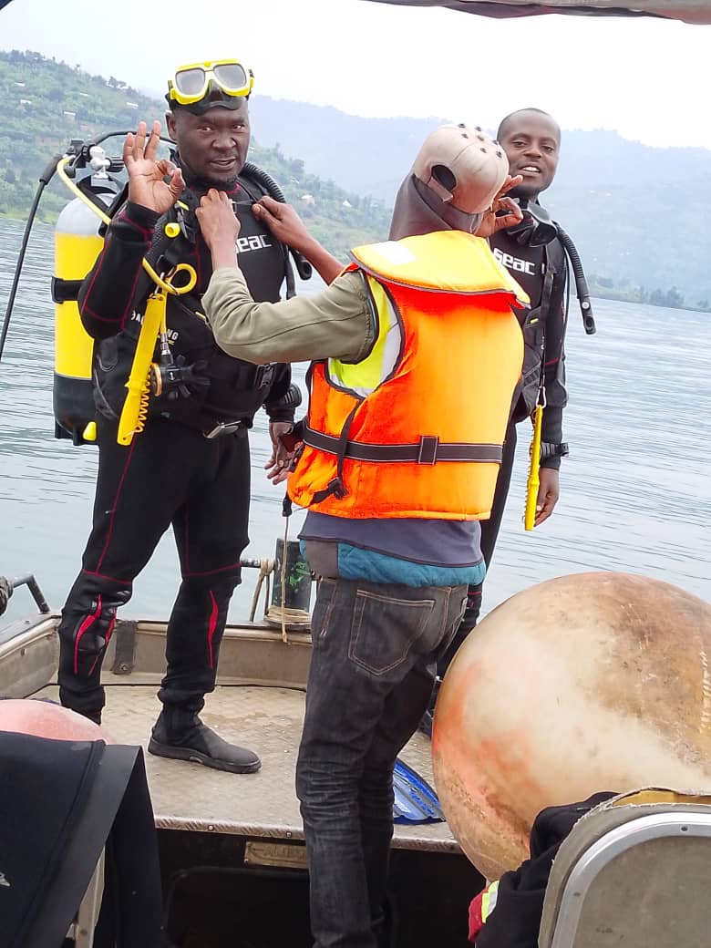 Two divers shaking hands on the boat before a dive